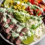 Cilantro lime steak bowl with fresh ingredients and seasoned steak