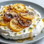 Whipped ricotta with charred lemon and hot honey served in a bowl