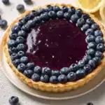 Delicious Blueberry–Lemon Curd Tart with fresh blueberries and lemon filling