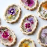 Vegan gluten-free Earl Grey stained glass floral cookies on a plate.