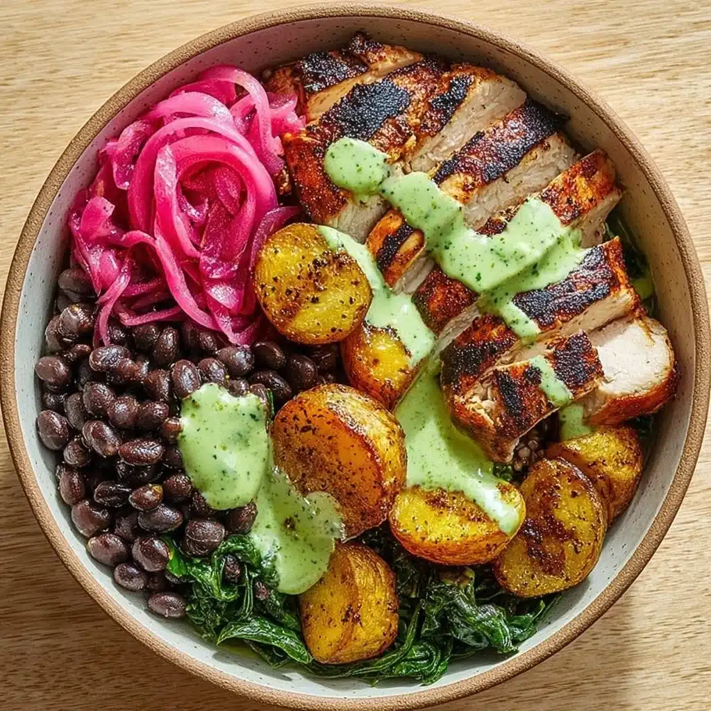 Mojo Chicken Bowl served with crispy plantains and black beans on a platter