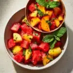 Delicious Peach and Watermelon Salad garnished with mint leaves