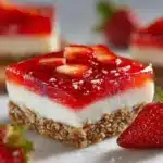 Delicious strawberry pretzel salad with creamy topping and pretzel crust