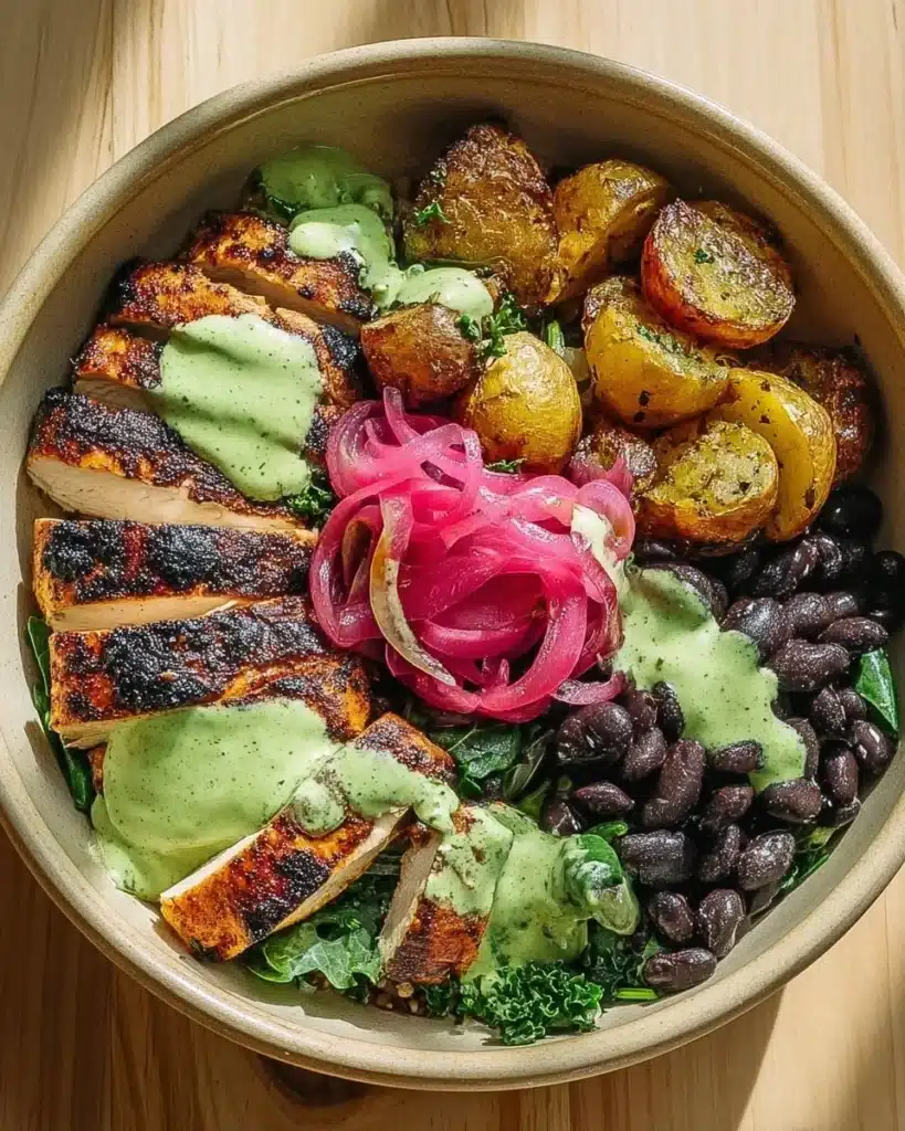 Mojo Chicken Bowl featuring crispy plantains and black beans on a plate