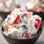 Ultimate Cheesecake Salad with fresh fruits and creamy cheesecake