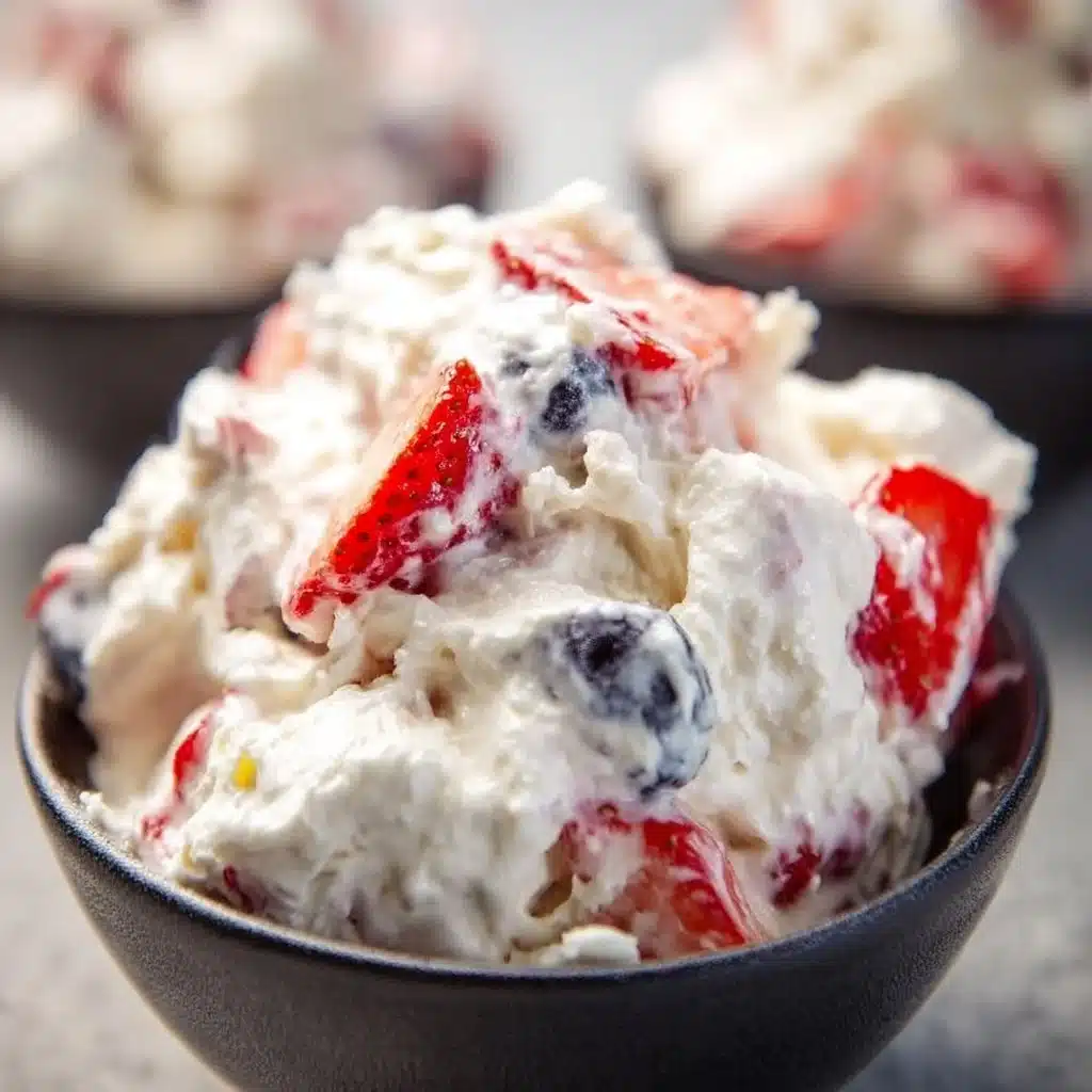 Ultimate Cheesecake Salad with fresh fruits and creamy cheesecake